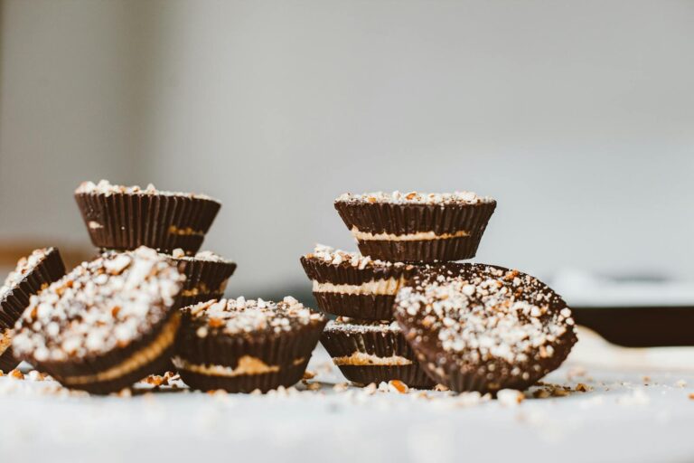 Delicious chocolate peanut butter cups topped with sprinkles, perfect for dessert lovers.
